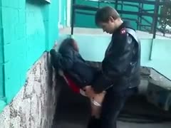 In the street, my friend copulates a whore's cum-hole from behind.